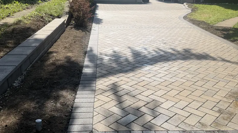 Herringbone paver driveway between two older homes in Indianapolis