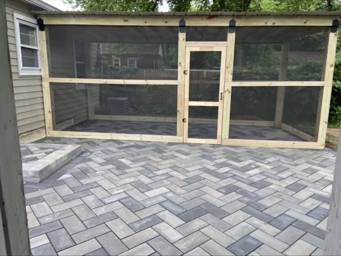 Herringbone paver patio in front of a screened outdoor room in Indianapolis
