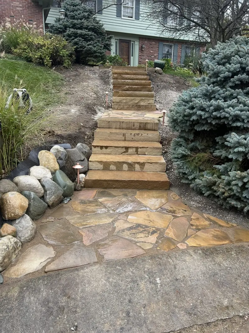 Natural stone slab steps and a flagstone landing leading up to a house in Indianapolis
