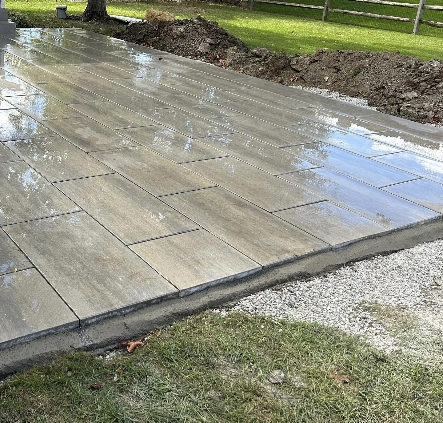 Large-format plank paver patio with a clean border in Fishers, IN